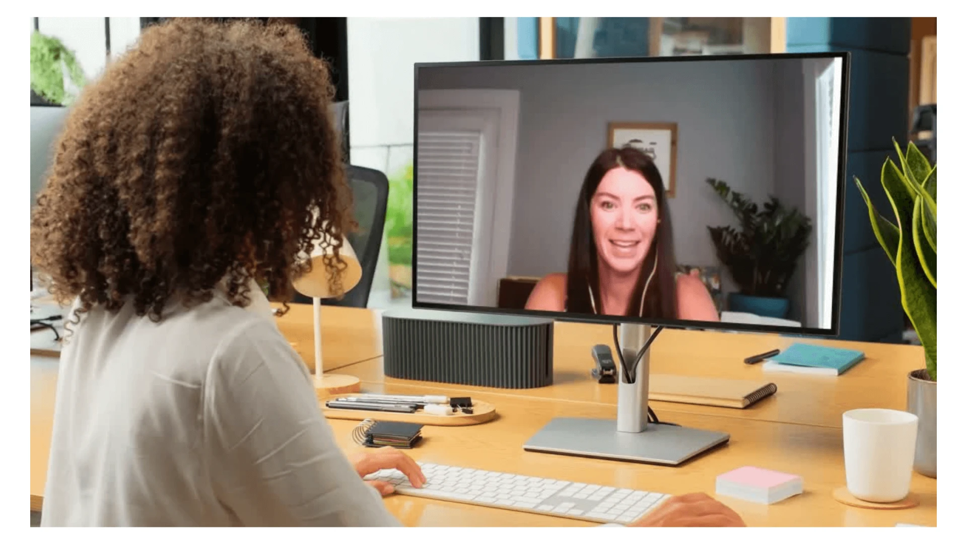 A coach speaking with a client over video